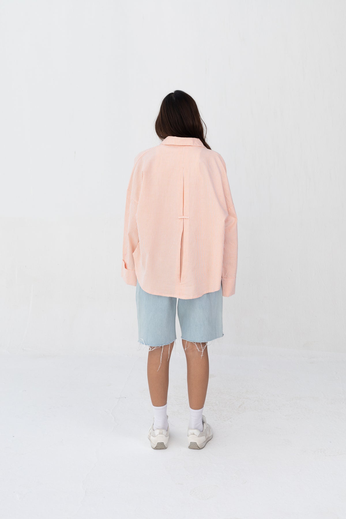 Subtle striped blouse with back bleats